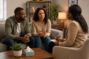 Couple talking with a therapist about relationship changes during a life transition